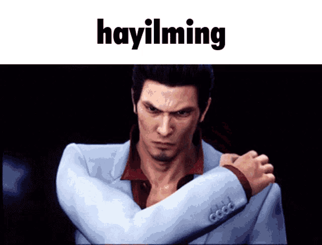 a man in a suit has his arms crossed and the word hayilming above him