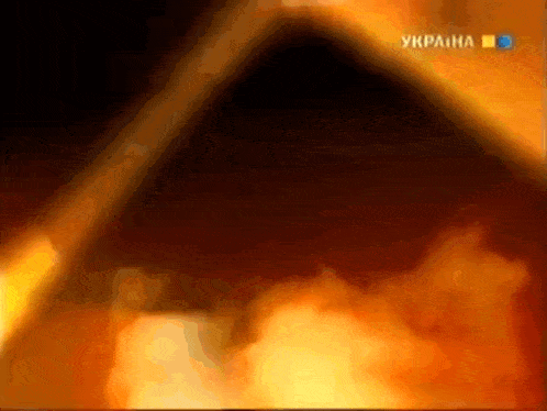 a tv screen shows a fire and says ukraine