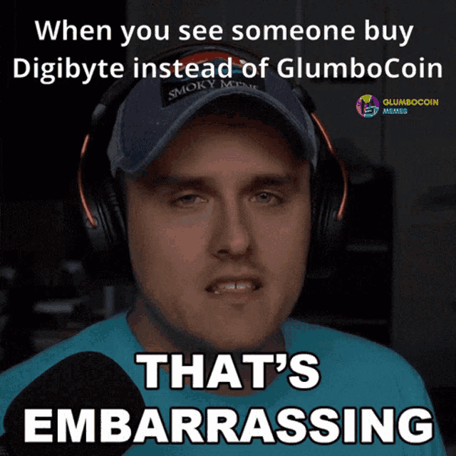 a man wearing headphones and a hat says that 's embarrassed