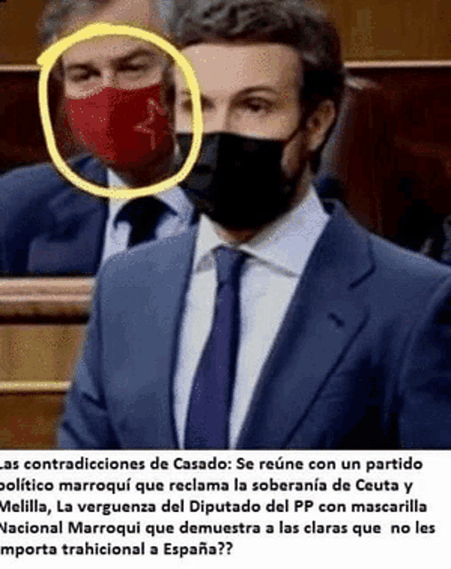 a man in a suit and tie is wearing a red face mask