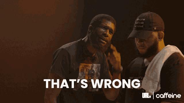two men are standing next to each other and the words that 's wrong are on the bottom