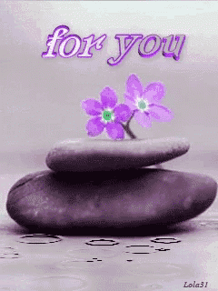 a stack of purple rocks with purple flowers and the words " for you " on the bottom