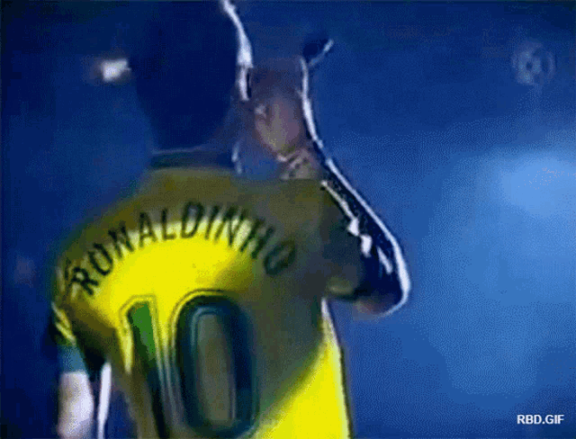 ronaldinho is wearing a yellow jersey with the number 10