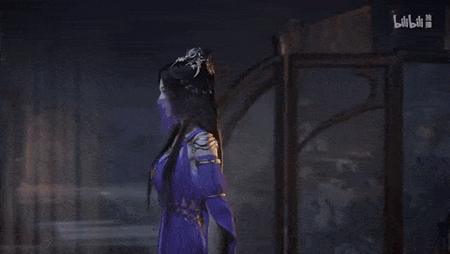 a woman with long hair and a purple mask on her face is standing in a room .