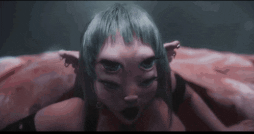 a close up of a woman 's face with a strange face