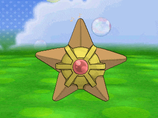 a star with a red stone in the middle is on a grassy field