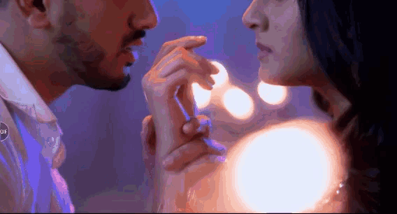 a man and woman are touching each other 's hands