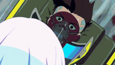 a man with a mask on his face is laying in a hospital bed