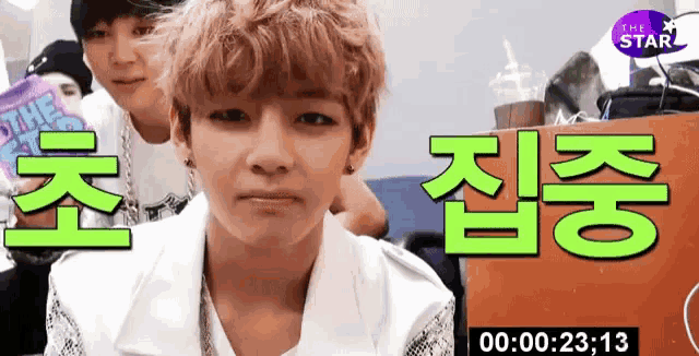 a video of a boy with korean writing on the bottom