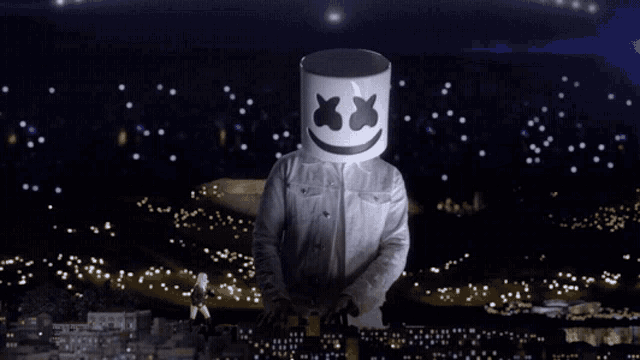 a man with a marshmallow head is standing in front of a crowd