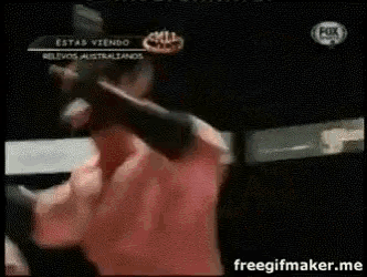 a man in a red shirt is boxing on fox