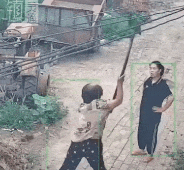 a man is holding a sword in front of a woman standing on a sidewalk .