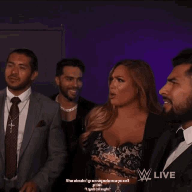 a man in a suit and tie stands next to a woman in a black dress and says " when when when when "