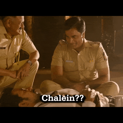 two police officers sit on the floor talking to a man laying on the floor with the words chalein written on the bottom
