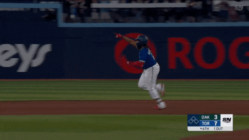 a baseball game is being played in front of a sn advertisement