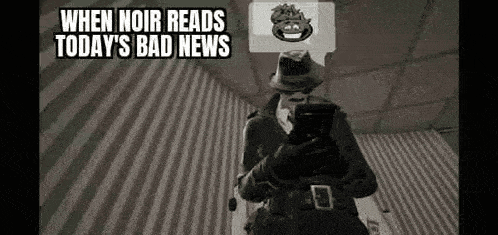 a black and white photo of a man in a fedora holding a gun and a cell phone .