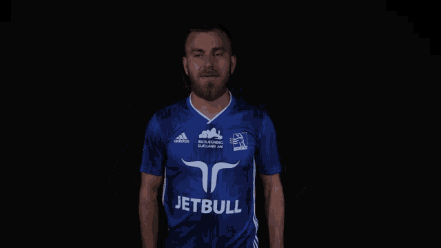 a man wearing a blue adidas jersey with the word jetblue on it