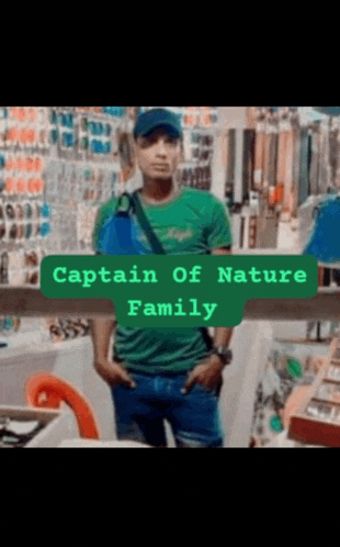 a man in a green shirt is standing in front of a store with the words captain of nature family above him