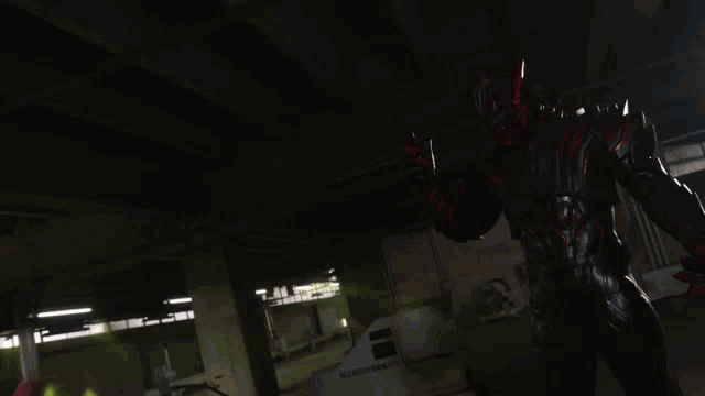a blurry picture of a person in a red and black costume