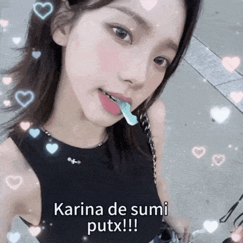 a girl is eating a gummy bear with the words karina de sumi putx written on the bottom .