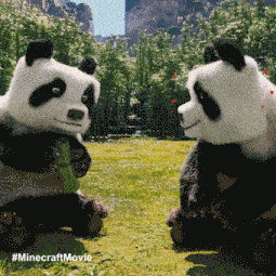 two panda bears are sitting next to each other in a field with a #minecraftmovie watermark