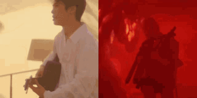 a man is playing a guitar and a man is holding a gun in a dark room .