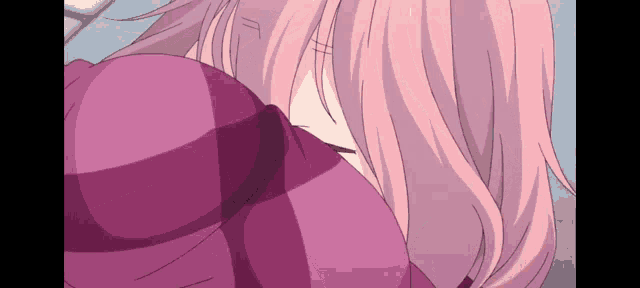 a girl with pink hair is wearing a purple sweater