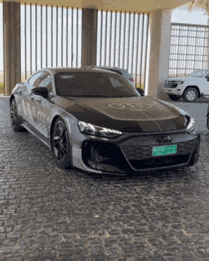 a black audi car with a license plate that says b3550