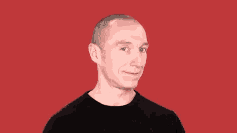 a man with a shaved head is wearing a black shirt against a red background