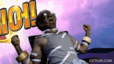 a man is sitting in a chair with his arms in the air and the word ioh is behind him