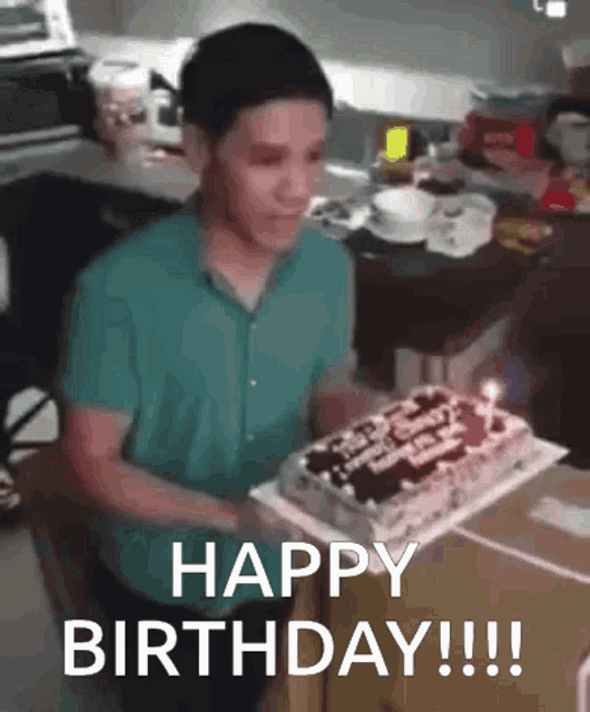 a man is blowing out candles on a birthday cake and says " happy birthday "