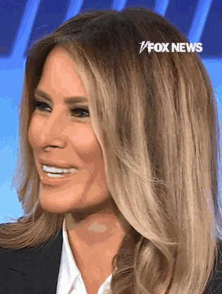 a close up of a woman 's face with fox news written on the bottom