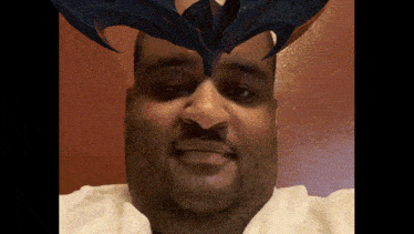 a man with a bat on his head