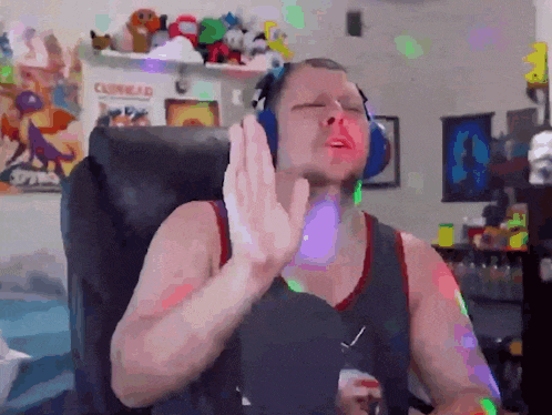 a man wearing headphones is sitting in a chair with his eyes closed