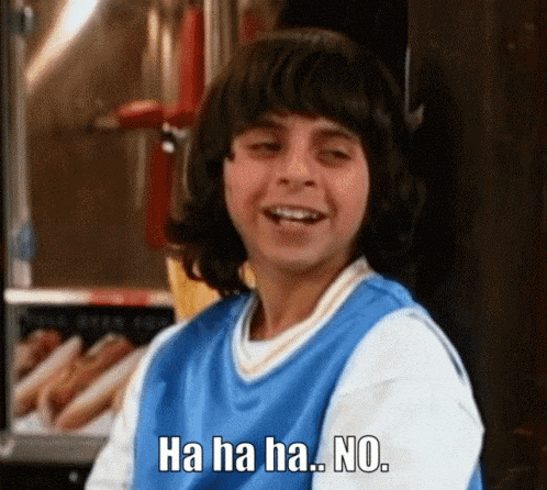 a young boy in a blue shirt is laughing and says ha ha ha no .
