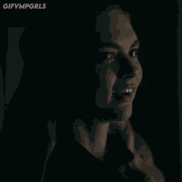 a close up of a woman 's face with the words gifvmpgrls below her