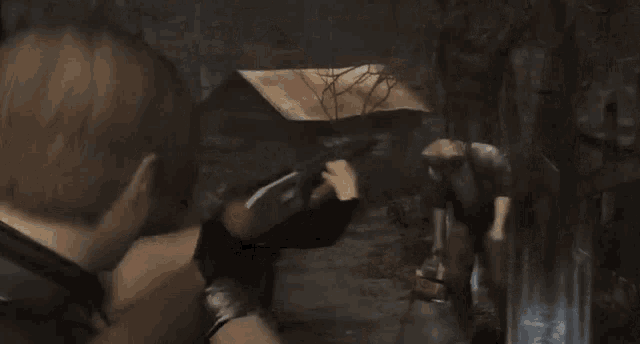 a man is holding a shotgun in a video game and shooting a zombie .