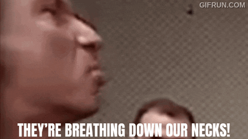 a man says they 're breathing down our necks in a gif