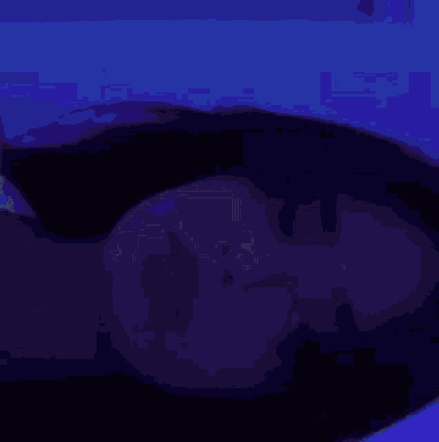a pixelated image of a person 's face with their eyes closed