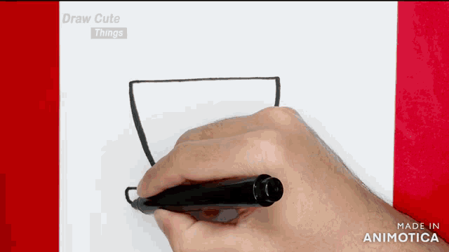 a person is drawing a cup with a black marker on a piece of paper