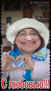 a woman wearing a pig nose making a heart with her hands