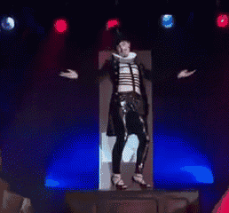 a man in a skeleton costume is dancing on a stage