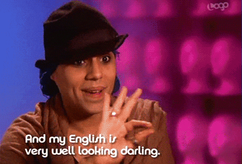 a woman wearing a hat and a ring says " and my english is very well looking darling "