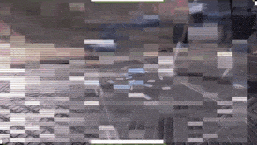 a blurred image of a person walking on a sidewalk