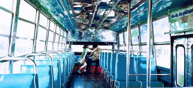 the inside of a bus with a sign that says do it in the dark