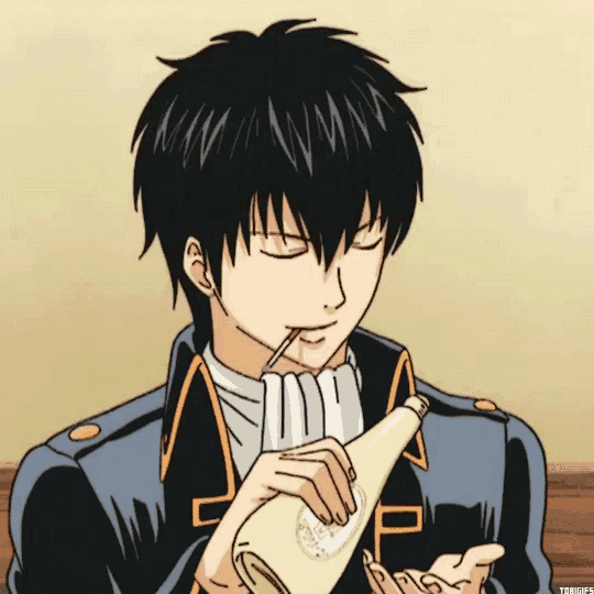 a man with a straw in his mouth is drinking from a bottle with the letter p on it