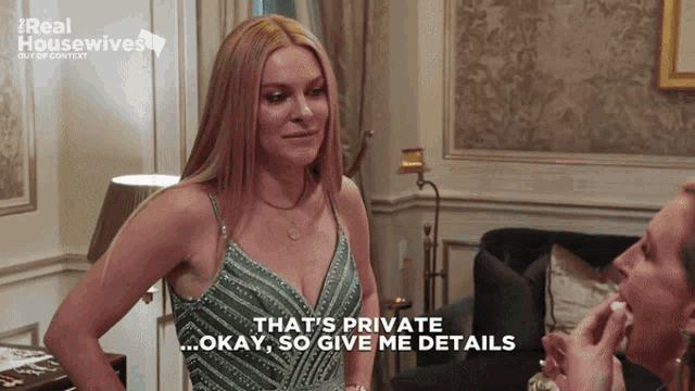 a woman in a green dress says that 's private so give me details