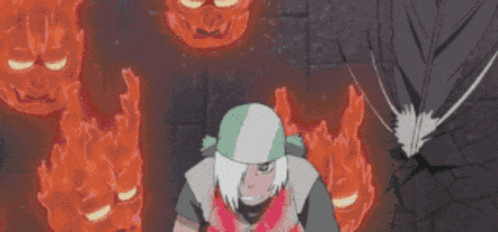 a man in a green and white hat is standing in front of a bunch of fire heads .