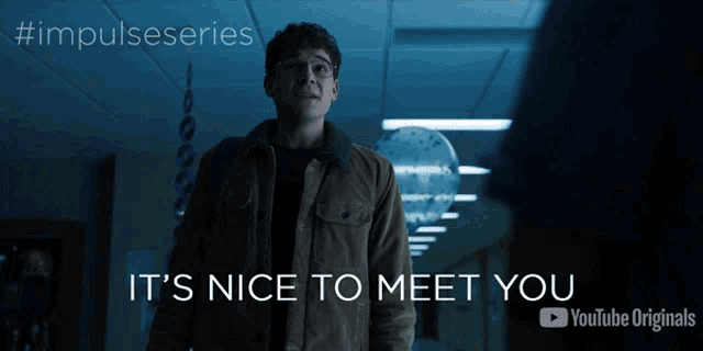 a man standing in a hallway with the words it 's nice to meet you below him