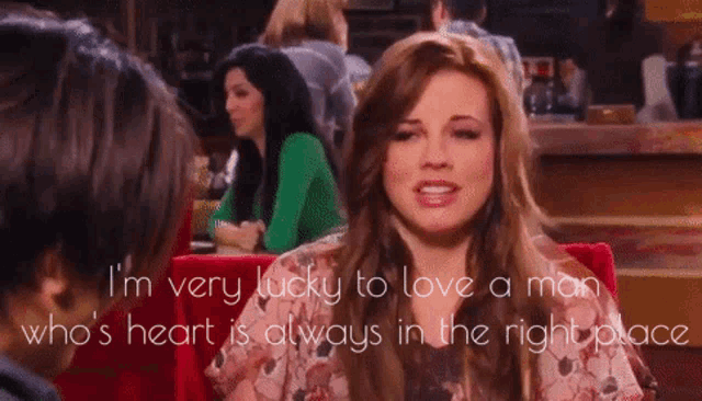 a woman is talking to a man in a restaurant and says i 'm very lucky